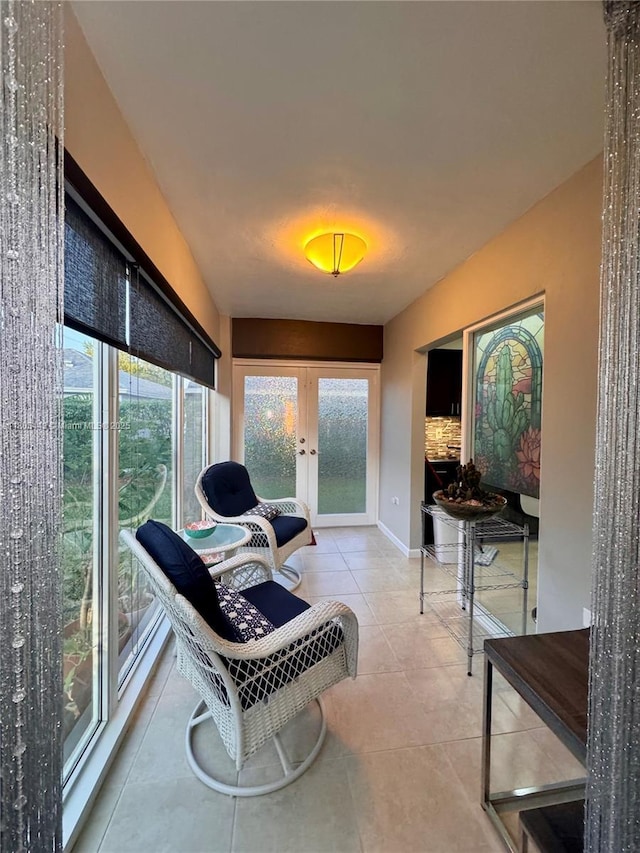 475 SE 20th Ln, Homestead, FL 33033 - sitting room featuring french doors, tile patterned flooring, and baseboards