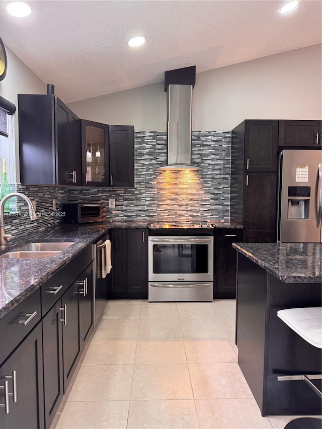 475 SE 20th Ln, Homestead, FL 33033 - kitchen with stainless steel refrigerator with ice dispenser, wall chimney exhaust hood, a sink, wall oven, and backsplash