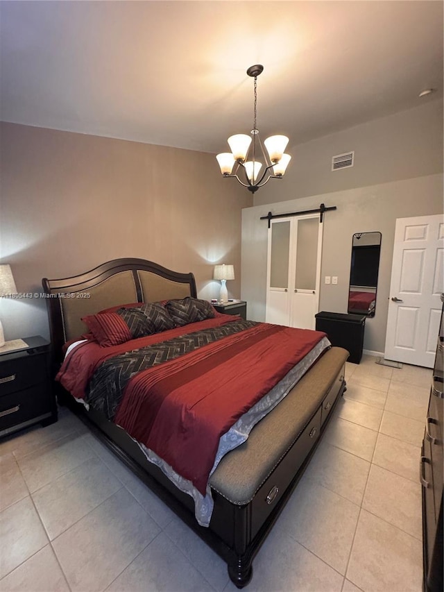 475 SE 20th Ln, Homestead, FL 33033 - bedroom with a barn door, a chandelier, and light tile patterned floors