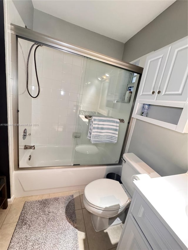 475 SE 20th Ln, Homestead, FL 33033 - full bath featuring toilet, tile patterned flooring, vanity, and shower / bath combination with glass door