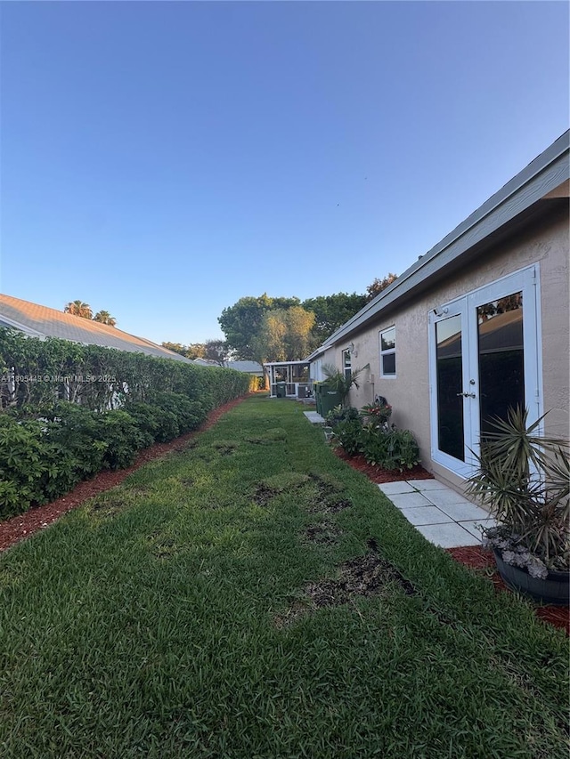 475 SE 20th Ln, Homestead, FL 33033 - view of grassy yard featuring french doors