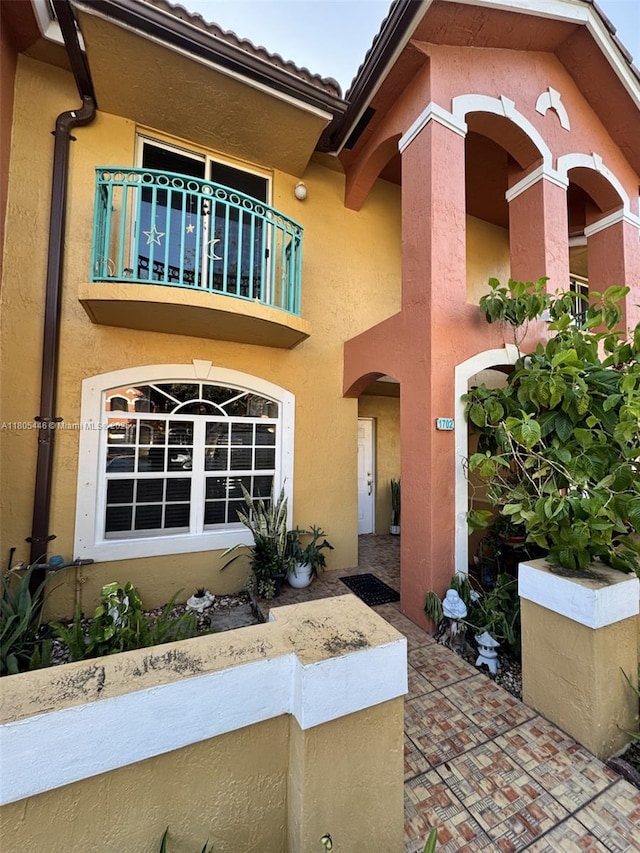 7005 NW 173rd Dr Unit 1702, Hialeah, FL 33015 - property entrance featuring a balcony and stucco siding