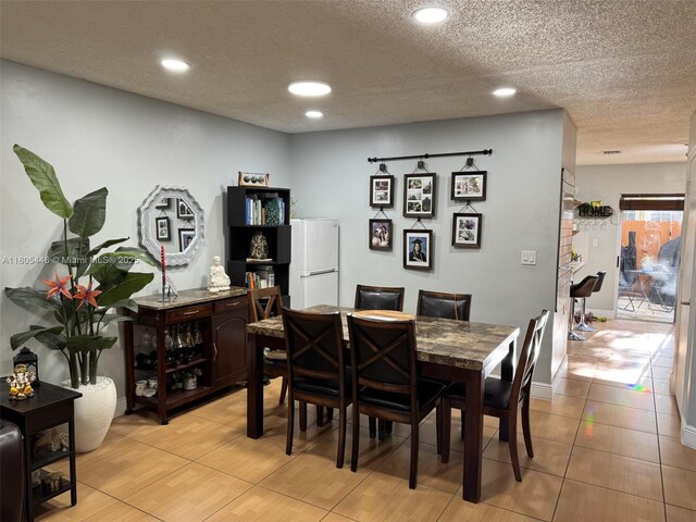 7005 NW 173rd Dr Unit 1702, Hialeah, FL 33015 - dining area featuring recessed lighting, light tile patterned floors, and a textured ceiling