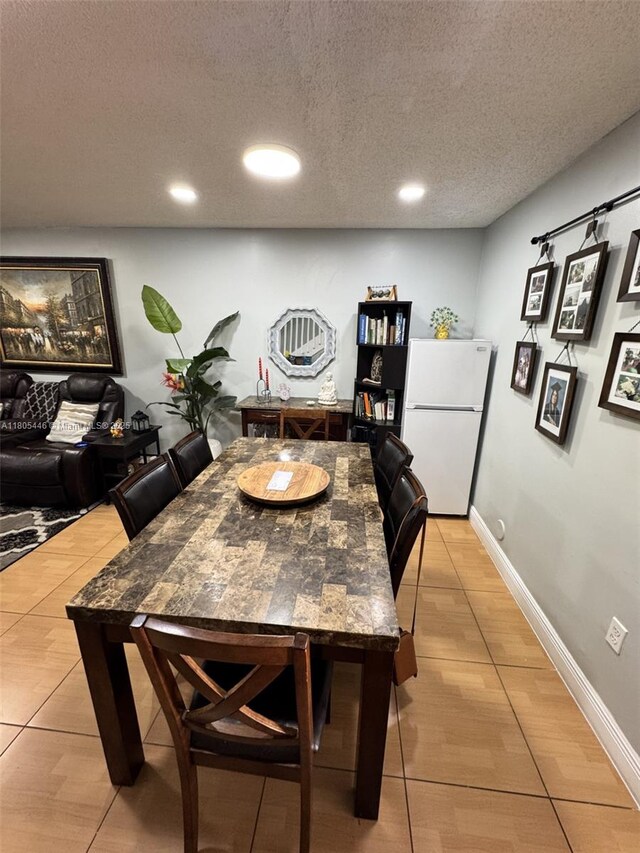 7005 NW 173rd Dr Unit 1702, Hialeah, FL 33015 - dining room featuring light tile patterned flooring, recessed lighting, a textured ceiling, and baseboards