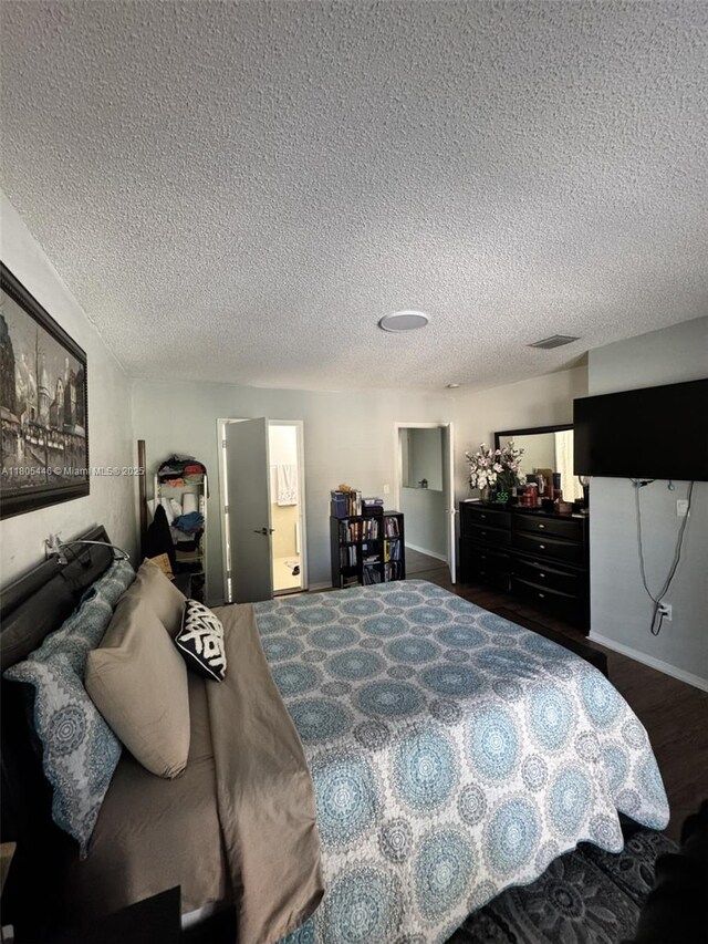 7005 NW 173rd Dr Unit 1702, Hialeah, FL 33015 - bedroom featuring a textured ceiling and baseboards