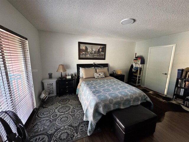 7005 NW 173rd Dr Unit 1702, Hialeah, FL 33015 - bedroom with a textured ceiling and wood finished floors