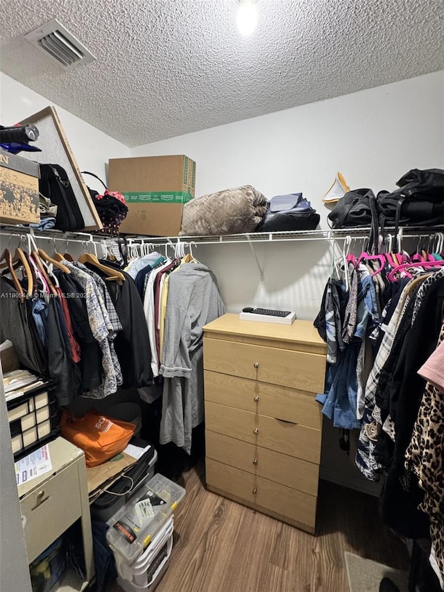 7005 NW 173rd Dr Unit 1702, Hialeah, FL 33015 - walk in closet featuring wood finished floors