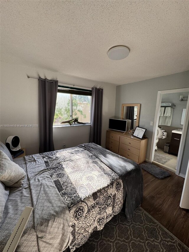 7005 NW 173rd Dr Unit 1702, Hialeah, FL 33015 - bedroom with dark wood-style floors, a textured ceiling, and ensuite bathroom