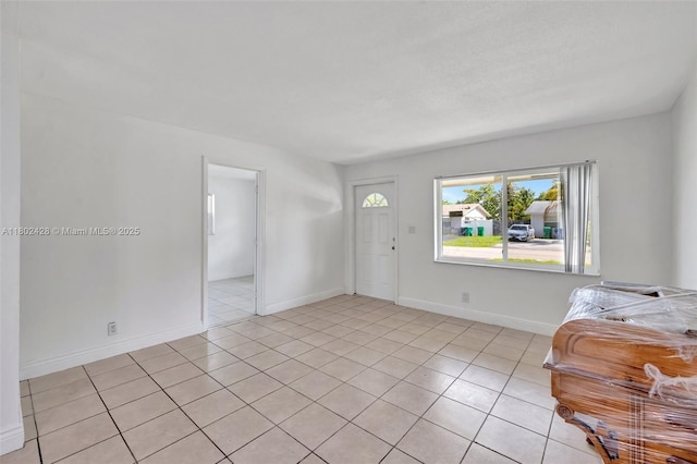5220-5224 NW 15th Ct, Lauderhill, FL 33313 - foyer featuring light tile patterned floors and baseboards