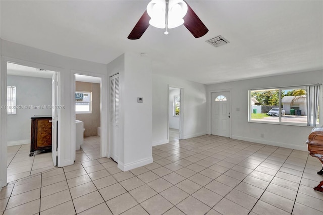 5220-5224 NW 15th Ct, Lauderhill, FL 33313 - entrance foyer featuring light tile patterned flooring, a ceiling fan, and baseboards