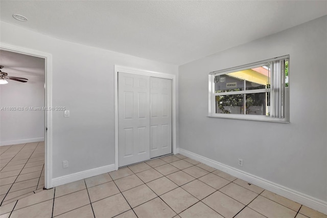 5220-5224 NW 15th Ct, Lauderhill, FL 33313 - unfurnished bedroom with light tile patterned floors, a closet, and baseboards
