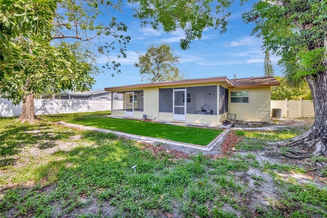 5220-5224 NW 15th Ct, Lauderhill, FL 33313 - rear view of property featuring a sunroom and stucco siding