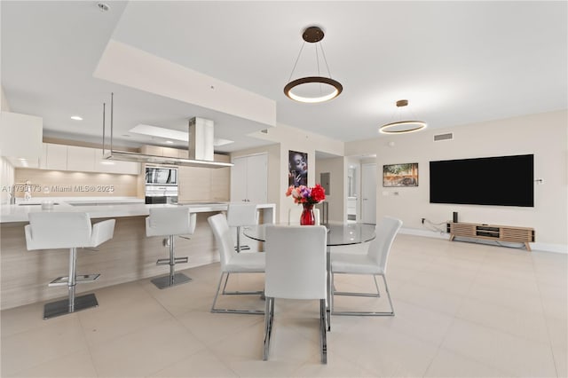17301 Biscayne Blvd Unit 603, North Miami Beach, FL 33160 - dining area with light tile patterned floors and baseboards
