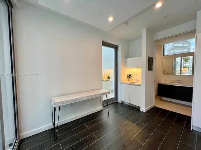 851 NE 1st Ave Unit Caba Pb23, Miami, FL 33132 - empty room with healthy amount of natural light, dark wood-style floors, a sink, and recessed lighting