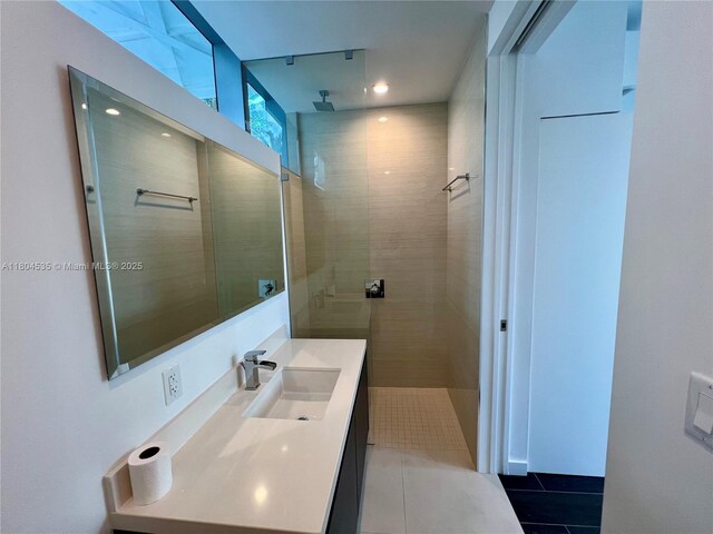 851 NE 1st Ave Unit Caba Pb23, Miami, FL 33132 - bathroom with tile patterned floors, a tile shower, vanity, and recessed lighting