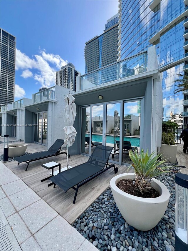 851 NE 1st Ave Unit Caba Pb23, Miami, FL 33132 - view of patio featuring a balcony and an outdoor pool