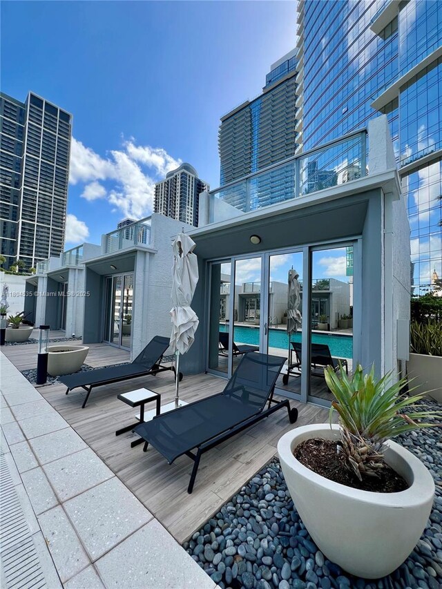 851 NE 1st Ave Unit Caba Pb23, Miami, FL 33132 - view of patio / terrace with an outdoor pool, a balcony, and a deck