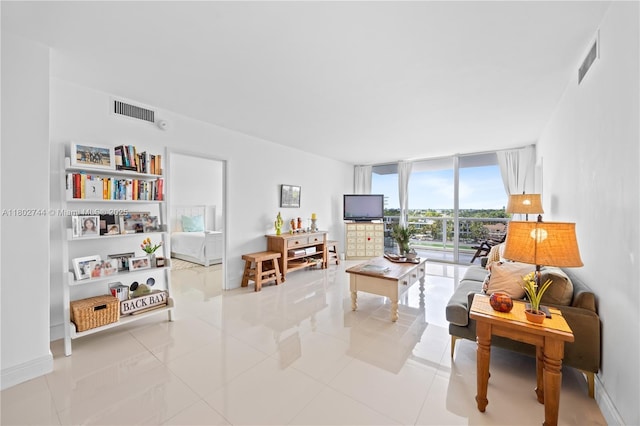 5700 Collins Ave Unit 7G, Miami Beach, FL 33140 - tiled living room featuring floor to ceiling windows