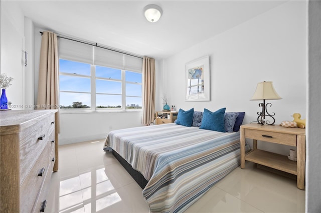 5700 Collins Ave Unit 7G, Miami Beach, FL 33140 - bedroom with light tile patterned flooring