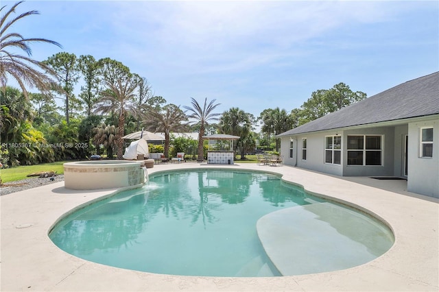 16783 92nd Ln, Loxahatchee, FL 33470 - view of pool featuring a patio area and a pool with connected hot tub