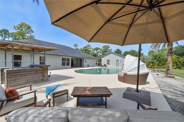 16783 92nd Ln, Loxahatchee, FL 33470 - outdoor pool featuring outdoor lounge area and a patio area