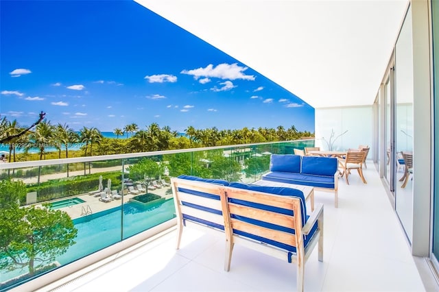 10203 Collins Ave Unit 302, Bal Harbour, FL 33154 - balcony with view of pool area, a hot tub, and an outdoor hangout area