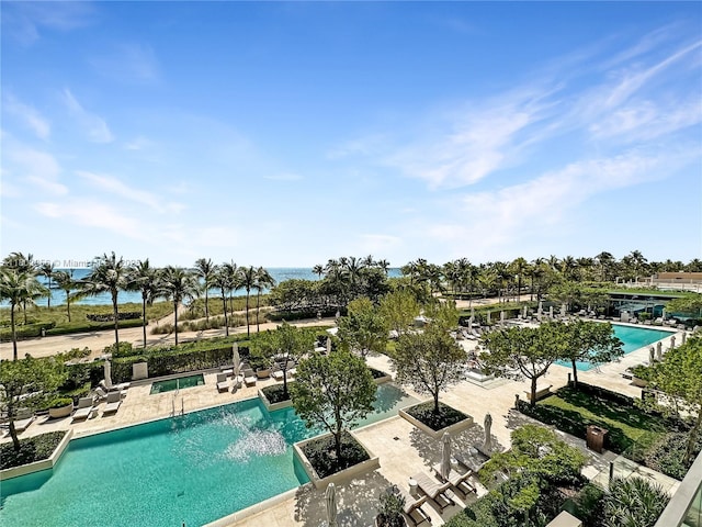 10203 Collins Ave Unit 302, Bal Harbour, FL 33154 - community pool featuring a patio and a hot tub