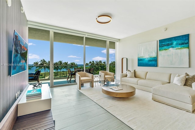 10203 Collins Ave Unit 302, Bal Harbour, FL 33154 - living room with a wall of windows, healthy amount of natural light, and a water view