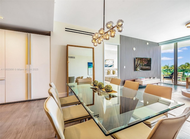 10203 Collins Ave Unit 302, Bal Harbour, FL 33154 - dining space featuring wood finished floors and a chandelier