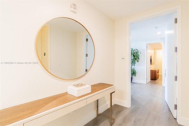 10203 Collins Ave Unit 302, Bal Harbour, FL 33154 - hallway with light wood-style flooring and baseboards