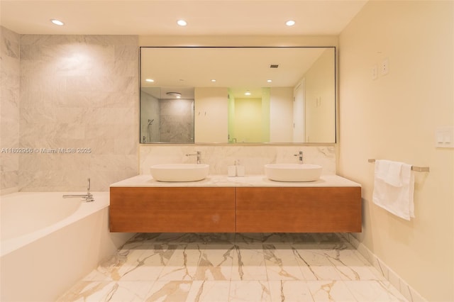 10203 Collins Ave Unit 302, Bal Harbour, FL 33154 - full bathroom with double vanity, a garden tub, marble look tile flooring, and recessed lighting