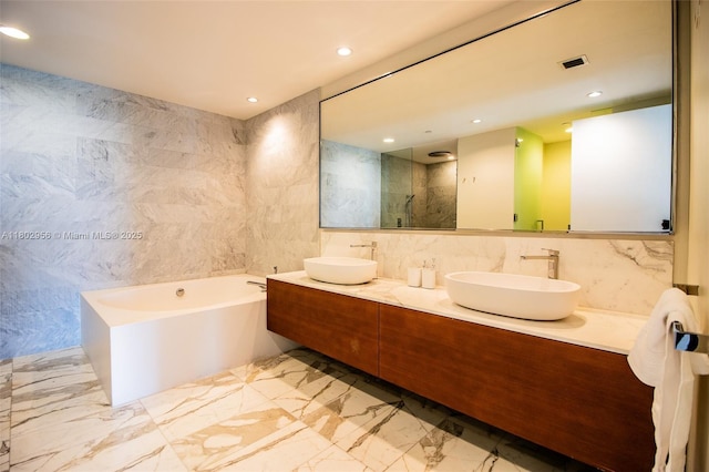 10203 Collins Ave Unit 302, Bal Harbour, FL 33154 - full bath with tile walls, a bath, double vanity, walk in shower, and recessed lighting