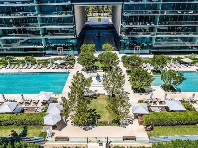 10203 Collins Ave Unit 302, Bal Harbour, FL 33154 - drone / aerial view of a pool area