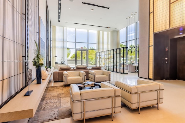 10203 Collins Ave Unit 302, Bal Harbour, FL 33154 - common area with a high ceiling and expansive windows