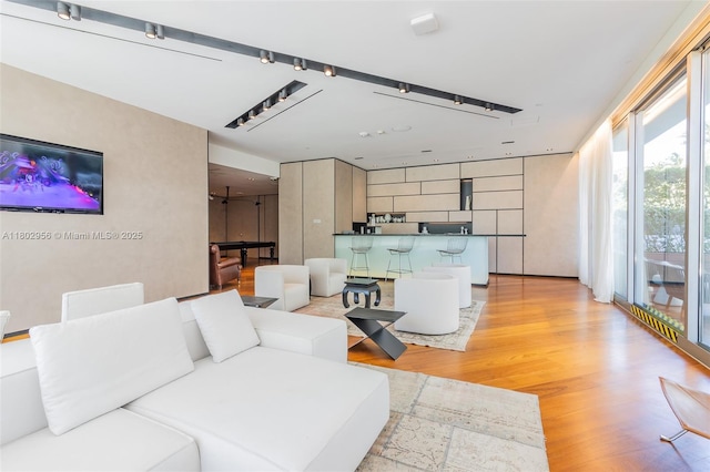 10203 Collins Ave Unit 302, Bal Harbour, FL 33154 - living room featuring light wood-style floors
