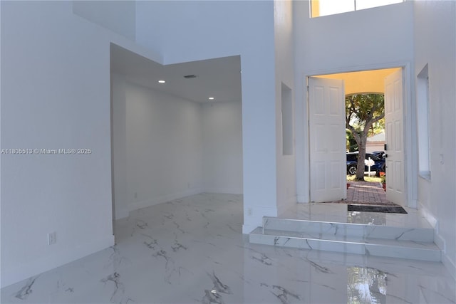 2925 SW 133rd Ave, Miramar, FL 33027 - foyer with baseboards, marble tiled floors, and a towering ceiling