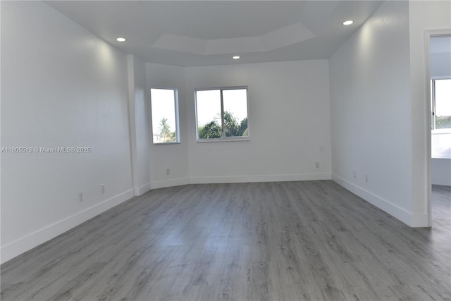 2925 SW 133rd Ave, Miramar, FL 33027 - unfurnished room featuring plenty of natural light, recessed lighting, a raised ceiling, wood finished floors, and baseboards