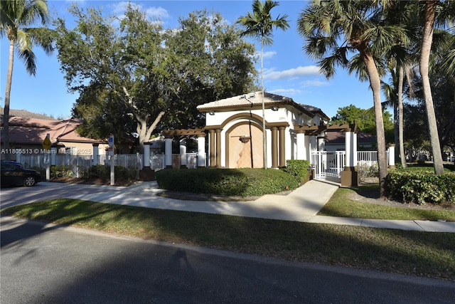 2925 SW 133rd Ave, Miramar, FL 33027 - view of front of property featuring fence, stucco siding, and a gate