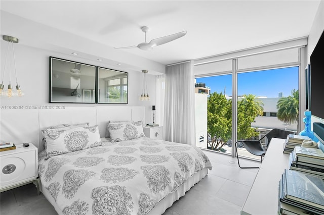 1201 20th St Unit 314, Miami Beach, FL 33139 - bedroom with access to outside, multiple windows, a ceiling fan, light tile patterned floors, and floor to ceiling windows