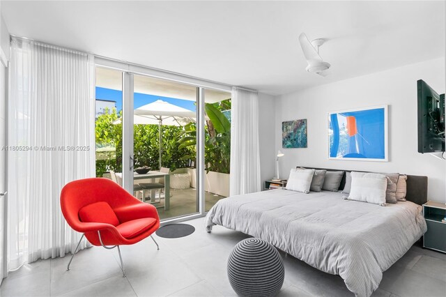 1201 20th St Unit 314, Miami Beach, FL 33139 - tiled bedroom featuring access to outside and floor to ceiling windows