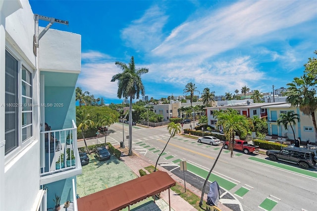 1150 Euclid Ave Unit 305, Miami Beach, FL 33139 - view of asphalt street featuring sidewalks, curbs, street lights, and a residential view