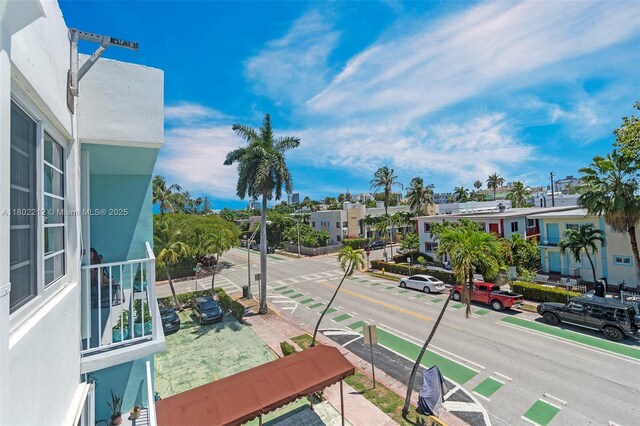 1150 Euclid Ave Unit 305, Miami Beach, FL 33139 - view of asphalt street featuring sidewalks, curbs, street lights, and a residential view