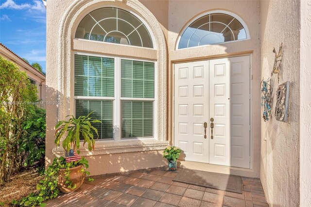 5957 NW 125th Ave, Coral Springs, FL 33076 - property entrance featuring stucco siding