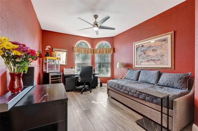 5957 NW 125th Ave, Coral Springs, FL 33076 - office area with a textured wall, a ceiling fan, wood finished floors, and a textured ceiling