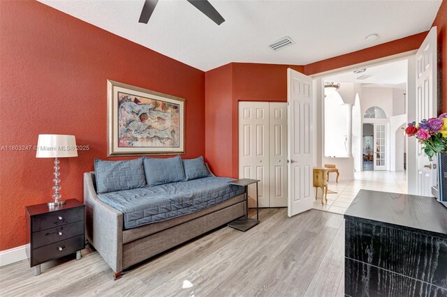 5957 NW 125th Ave, Coral Springs, FL 33076 - sitting room featuring a textured wall, a ceiling fan, light wood-style flooring, and baseboards
