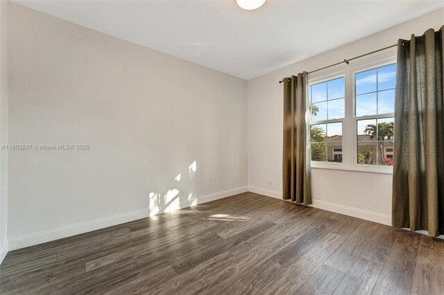 5957 NW 125th Ave, Coral Springs, FL 33076 - empty room featuring wood finished floors and baseboards