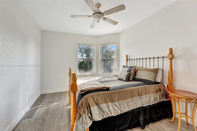 5957 NW 125th Ave, Coral Springs, FL 33076 - bedroom featuring wood finished floors, baseboards, and ceiling fan