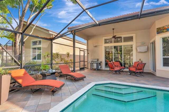 5957 NW 125th Ave, Coral Springs, FL 33076 - outdoor pool with grilling area, a lanai, a patio area, and ceiling fan