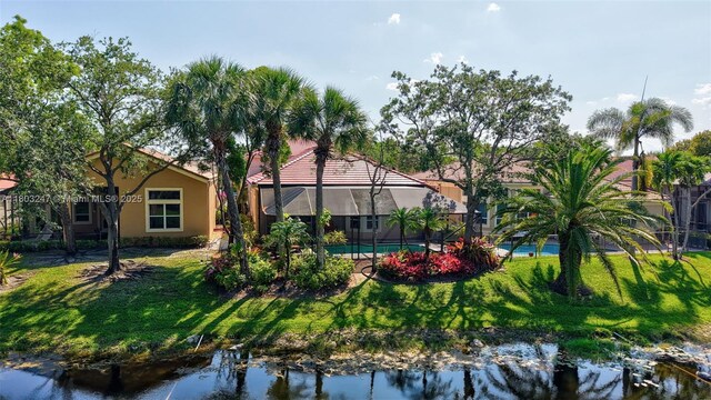 5957 NW 125th Ave, Coral Springs, FL 33076 - rear view of house with a lawn and stucco siding