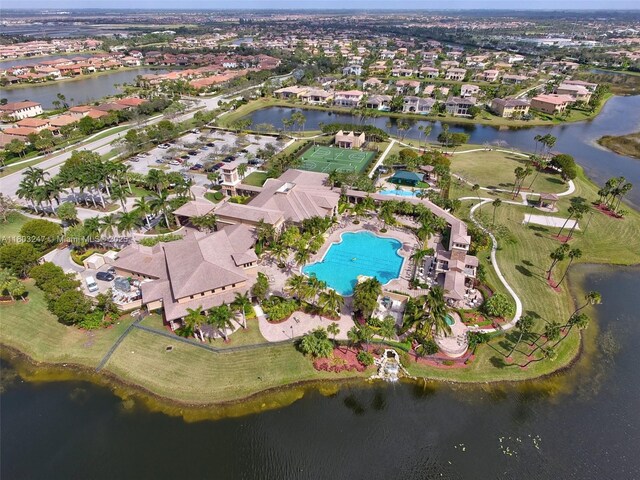 5957 NW 125th Ave, Coral Springs, FL 33076 - aerial view of property and surrounding area featuring a pool, a nearby body of water, and nearby suburban area